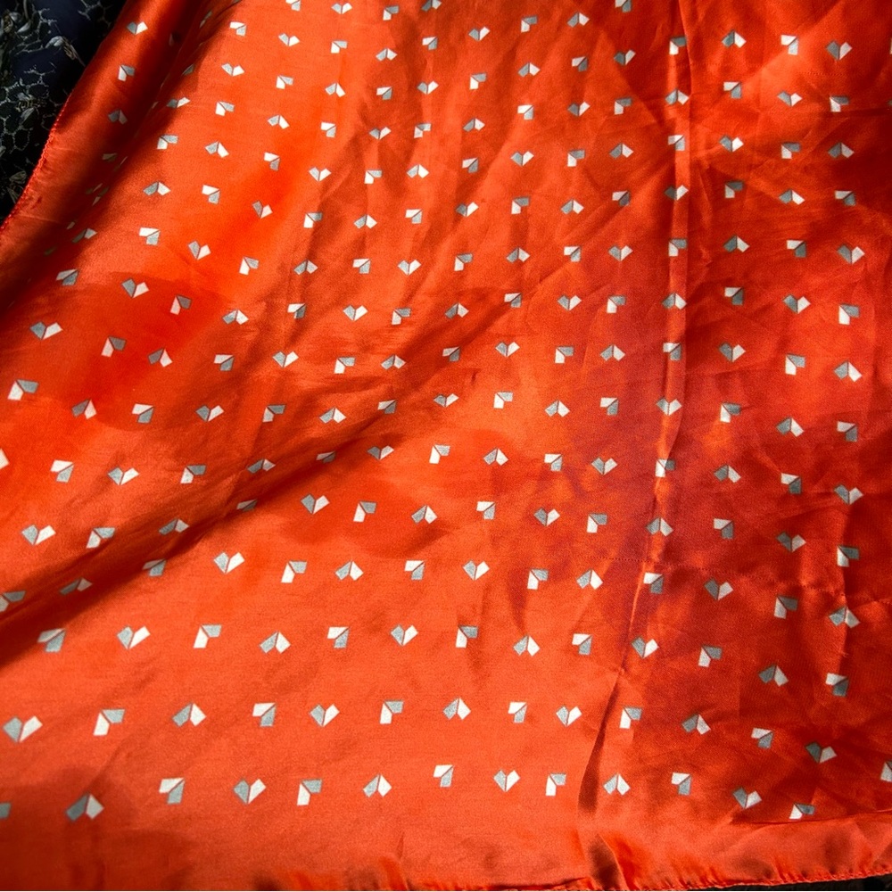 Orange silky scarf with small diamond pattern good condition